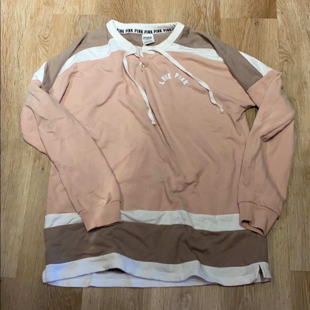 Victoria’s Secret pink sweatshirt.